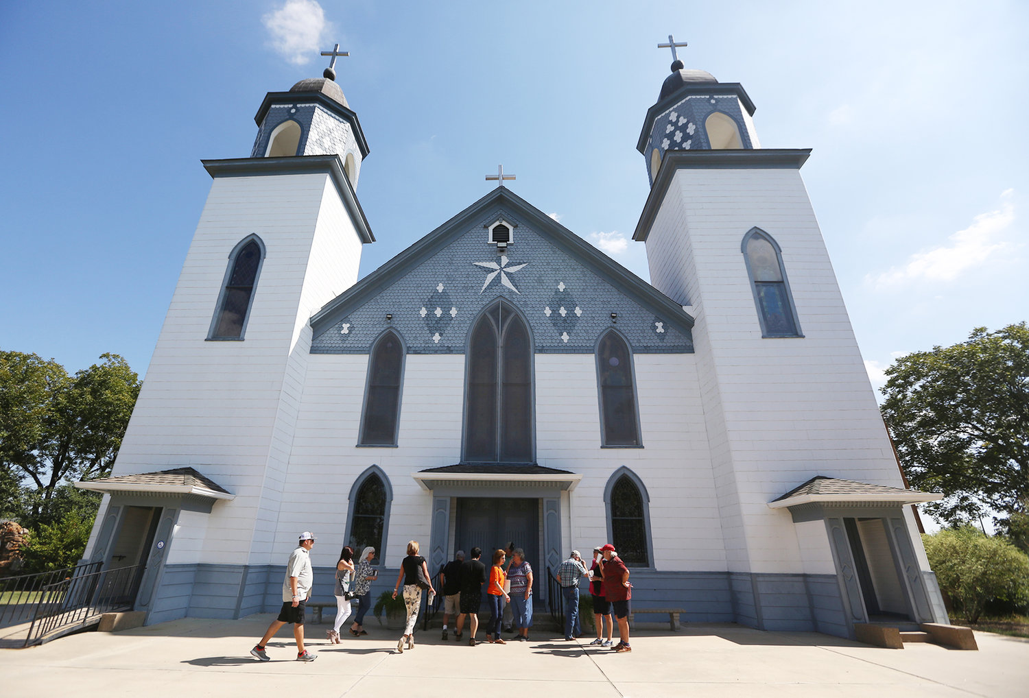 Parishioners enter the historic 124-year-old Church of the Visitation Oct. 7, 2017, in Westphalia, Texas. The church was destroyed in a fire the morning of July 29, 2019. The parish has served the Catholic community of southwestern Falls County, many of them immigrants from the northwest German region of Westphalia, since 1883.